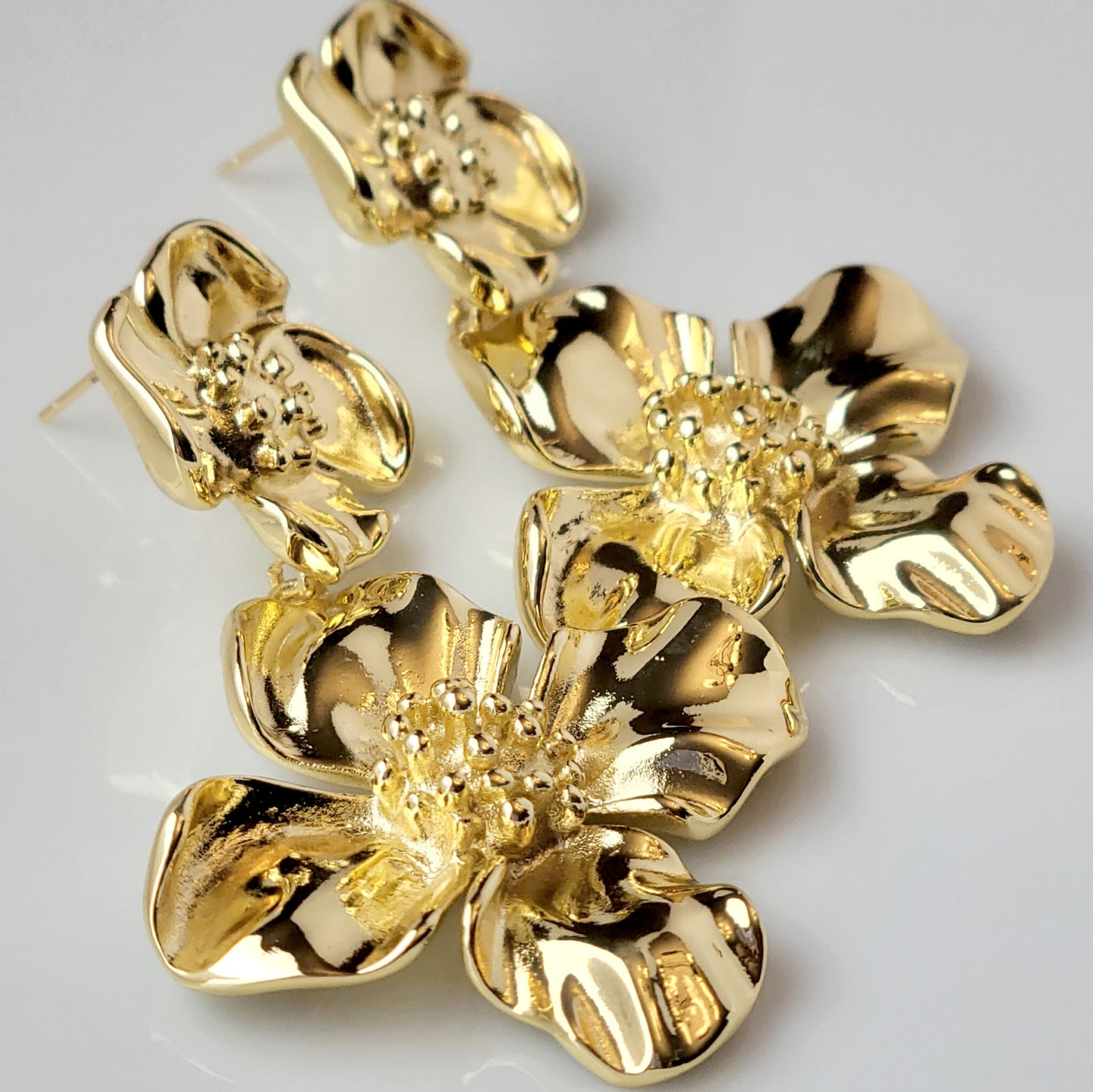 Expertly crafted with hypoallergenic stainless steel, our Double Flower Dangle Earrings are both sustainable and low maintenance. With superior quality and lightweight design, these earrings are perfect for everyday wear. Say goodbye to tarnishing and hello to timeless style.