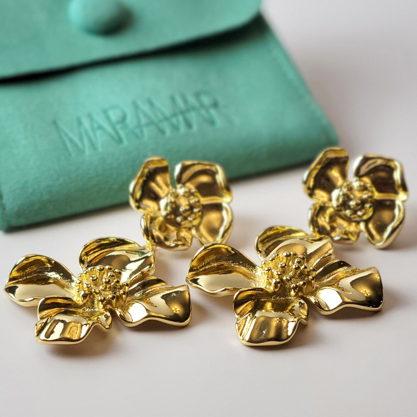 Expertly crafted with hypoallergenic stainless steel, our Double Flower Dangle Earrings are both sustainable and low maintenance. With superior quality and lightweight design, these earrings are perfect for everyday wear. Say goodbye to tarnishing and hello to timeless style.