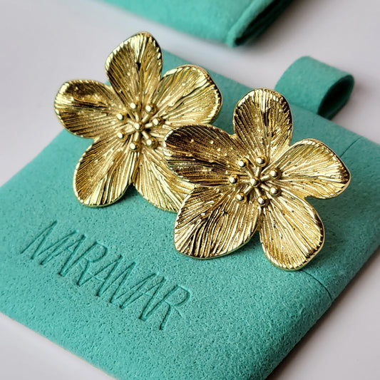 Expertly crafted from hypoallergenic, tarnish-proof stainless steel, these Gold Flower Stud Earrings offer both quality and sustainability. With a low maintenance design and lightweight feel, these earrings are the perfect addition to any jewelry collection.