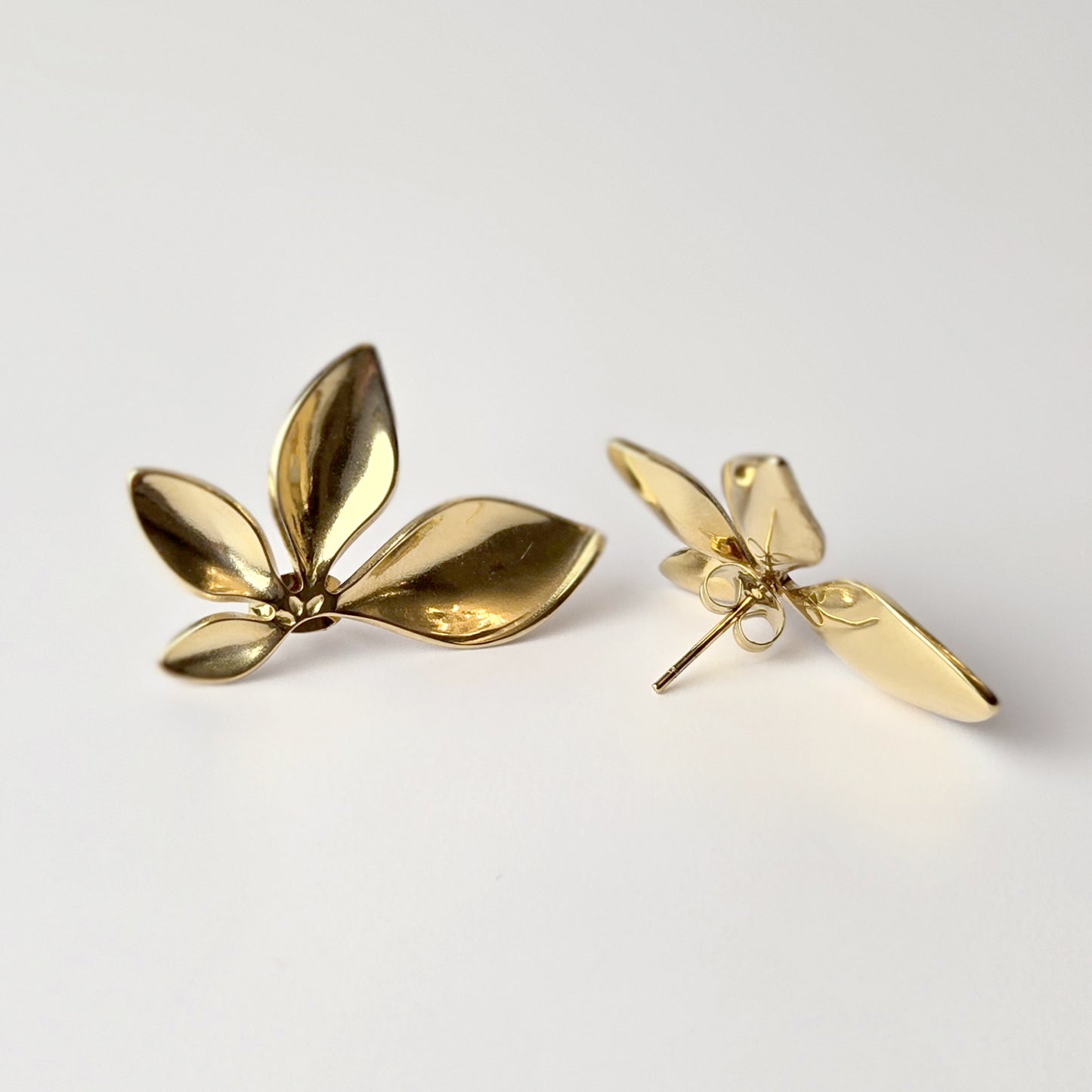 Expertly crafted with the highest quality stainless steel, these half flower stud earrings offer hypoallergenic and water-resistant wear. Sweat-proof and tarnish-proof, they require low maintenance and are a sustainable choice. Lightweight and stylish, these earrings are a must-have for any jewelry collection.