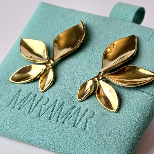 Expertly crafted with the highest quality stainless steel, these half flower stud earrings offer hypoallergenic and water-resistant wear. Sweat-proof and tarnish-proof, they require low maintenance and are a sustainable choice. Lightweight and stylish, these earrings are a must-have for any jewelry collection.