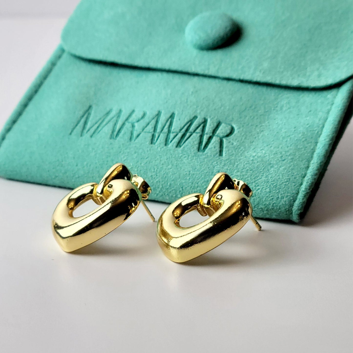 Introducing our Gold Heart Dangle Earrings, crafted from hypoallergenic, tarnish-proof stainless steel. These earrings are not only sustainable, but also low maintenance and lightweight for comfortable wear. Upgrade your style with the highest quality and durability.
