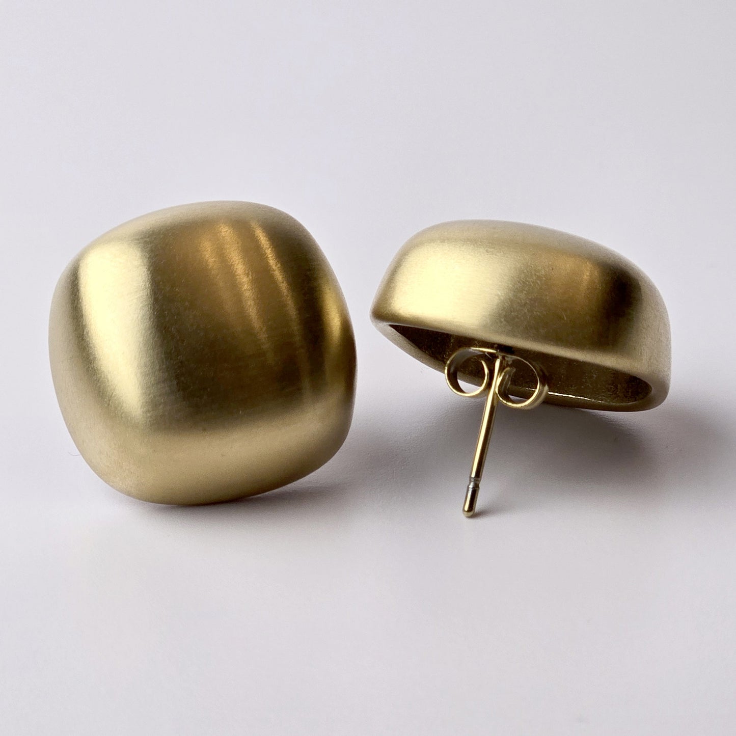 Expertly crafted with the highest quality hypoallergenic stainless steel, these Gold Matte Square Stud Earrings are perfect for those with sensitive skin. Not only are they water-resistant and sweat-resistant, but also tarnish-proof for long-lasting wear. Plus, their sustainable and lightweight design makes them low maintenance and easy to wear all day.