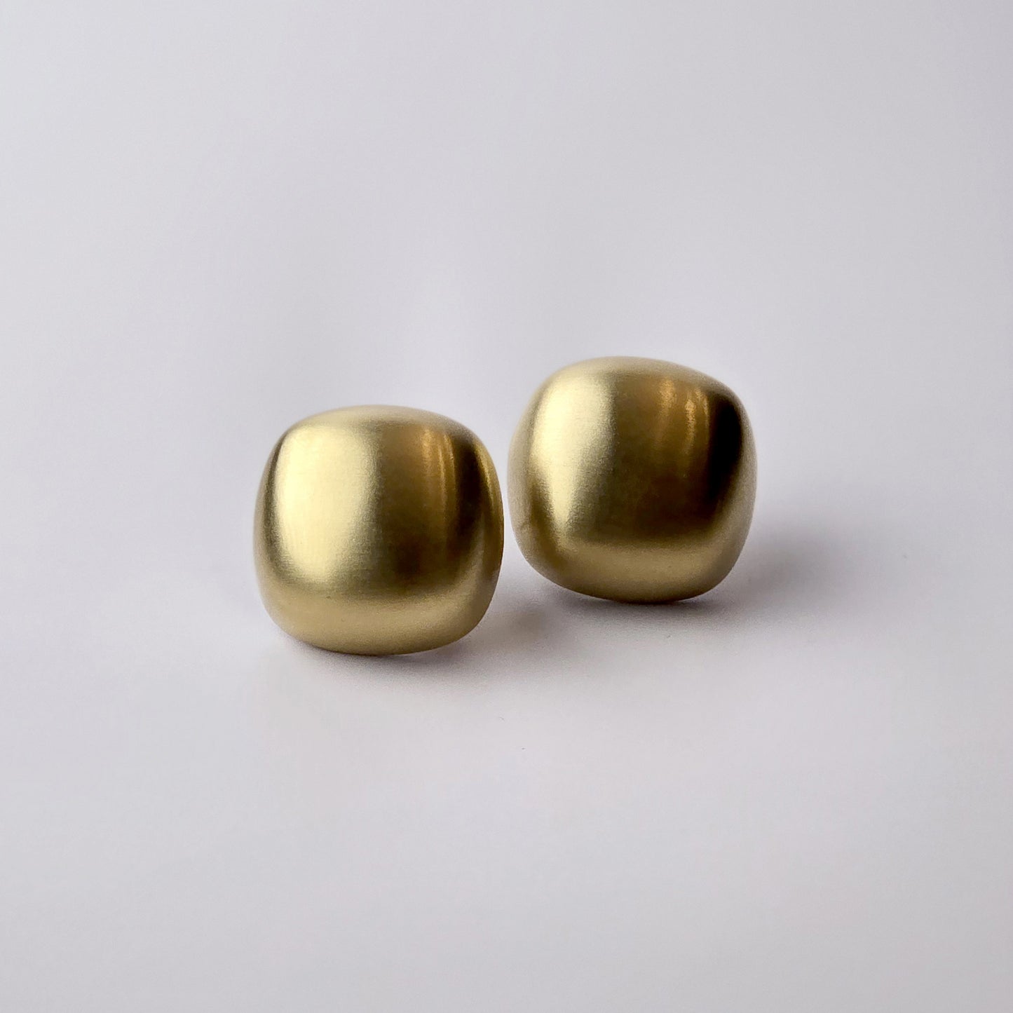 Expertly crafted with the highest quality hypoallergenic stainless steel, these Gold Matte Square Stud Earrings are perfect for those with sensitive skin. Not only are they water-resistant and sweat-resistant, but also tarnish-proof for long-lasting wear. Plus, their sustainable and lightweight design makes them low maintenance and easy to wear all day.