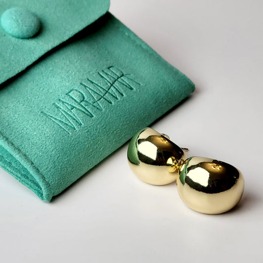 Expertly crafted with hypoallergenic stainless steel, these Golden Bean Stud Earrings are not only stylish but also sustainable. Tarnish-proof and low maintenance, they offer the perfect balance of quality and ease for everyday wear. Elevate your jewelry collection with these lightweight must-haves.