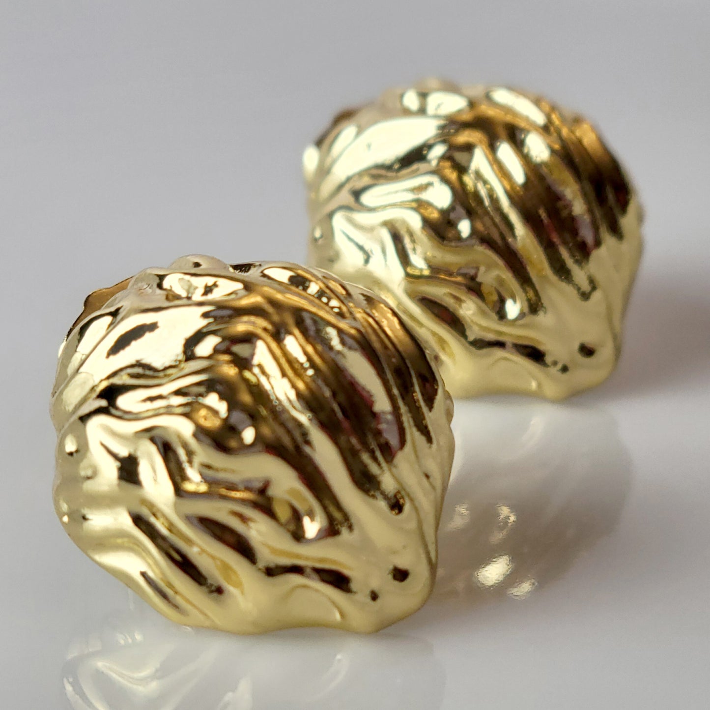 Crafted from premium, hypoallergenic stainless steel, our Golden Walnut Stud Earrings are built to last. The tarnish-proof material ensures they will maintain their shine for years to come. Plus, they're lightweight and sustainable, making them the perfect low maintenance accessory for any outfit.