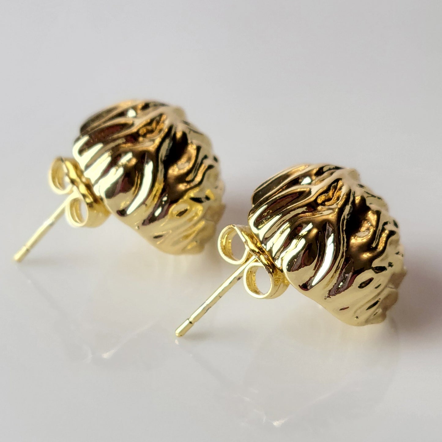 Crafted from premium, hypoallergenic stainless steel, our Golden Walnut Stud Earrings are built to last. The tarnish-proof material ensures they will maintain their shine for years to come. Plus, they're lightweight and sustainable, making them the perfect low maintenance accessory for any outfit.