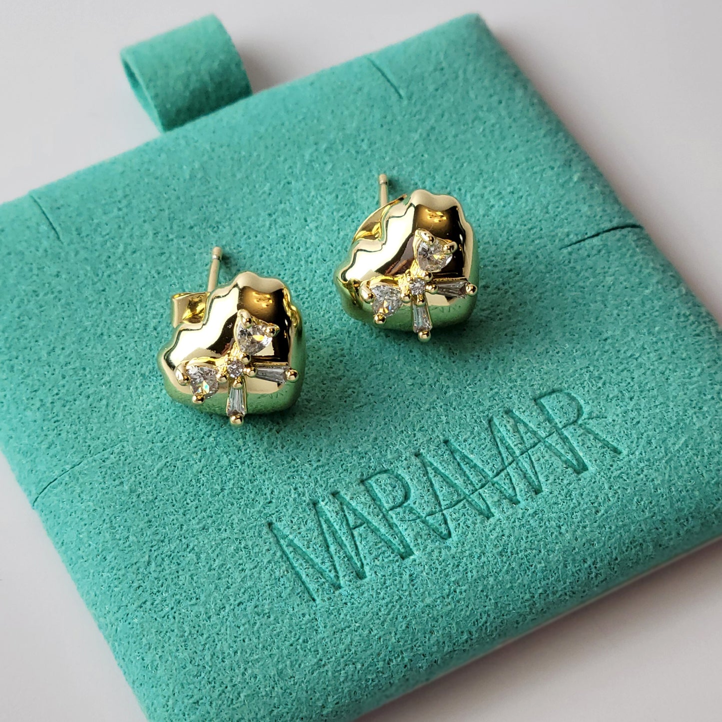 These Heart & Ribbon Stud Earrings are crafted from high-quality, hypoallergenic stainless steel that is both tarnish-proof and sustainable. Not only are these earrings low maintenance and lightweight, but they also make a great choice for those with sensitive skin. Complete your look with these stylish and eco-friendly earrings.