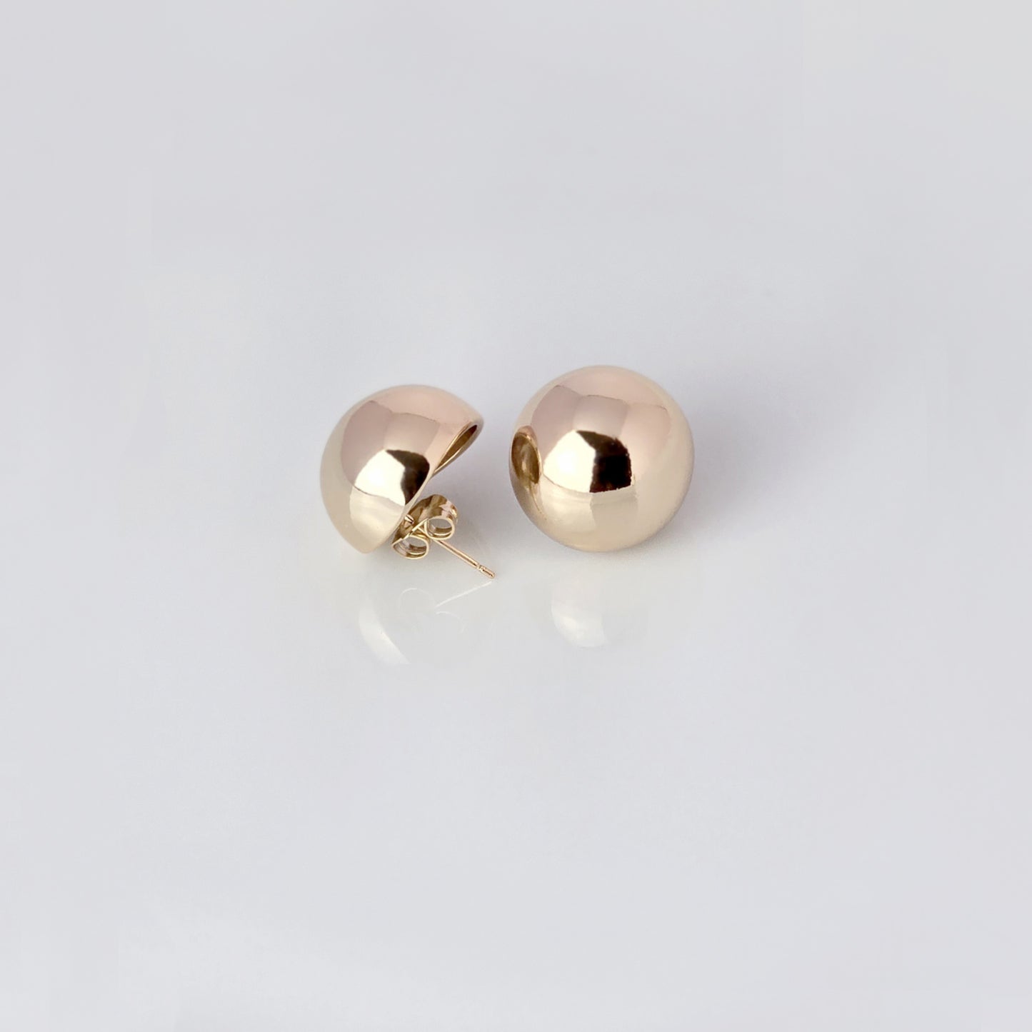 Crafted with precision and expertly designed, our Large Rose Gold Half Ball Stud Earrings are the perfect choice for those seeking high-quality and sustainable fashion. Made with hypoallergenic and tarnish-proof stainless steel, these earrings are low-maintenance and lightweight, making them a comfortable and stylish addition to any outfit.
