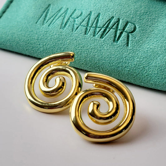These Medium Gold Spiral Stud Earrings are crafted with highest quality hypoallergenic stainless steel, ensuring they are both tarnish-proof and sustainable. With low maintenance and a lightweight design, these earrings are perfect for everyday wear.