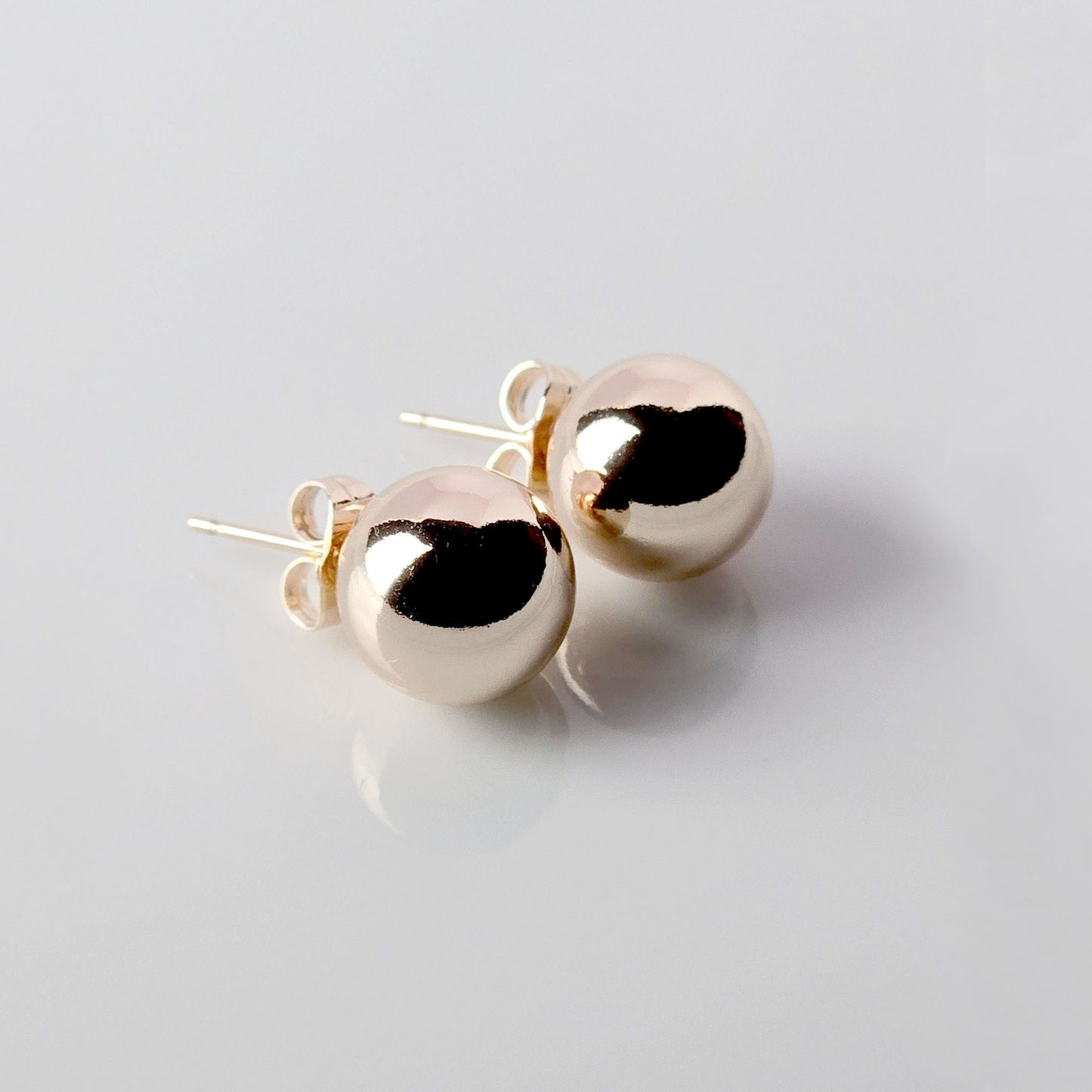 Made with the highest quality hypoallergenic, tarnish-proof stainless steel, our Medium Rose Gold Classic Ball Stud Earrings are both sustainable and low maintenance. You can wear these lightweight earrings every day without worrying about any allergic reactions or tarnishing. Upgrade your jewelry collection with these timeless and durable studs.