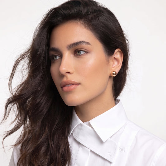Made with the highest quality hypoallergenic, tarnish-proof stainless steel, our Medium Rose Gold Classic Ball Stud Earrings are both sustainable and low maintenance. You can wear these lightweight earrings every day without worrying about any allergic reactions or tarnishing. Upgrade your jewelry collection with these timeless and durable studs.