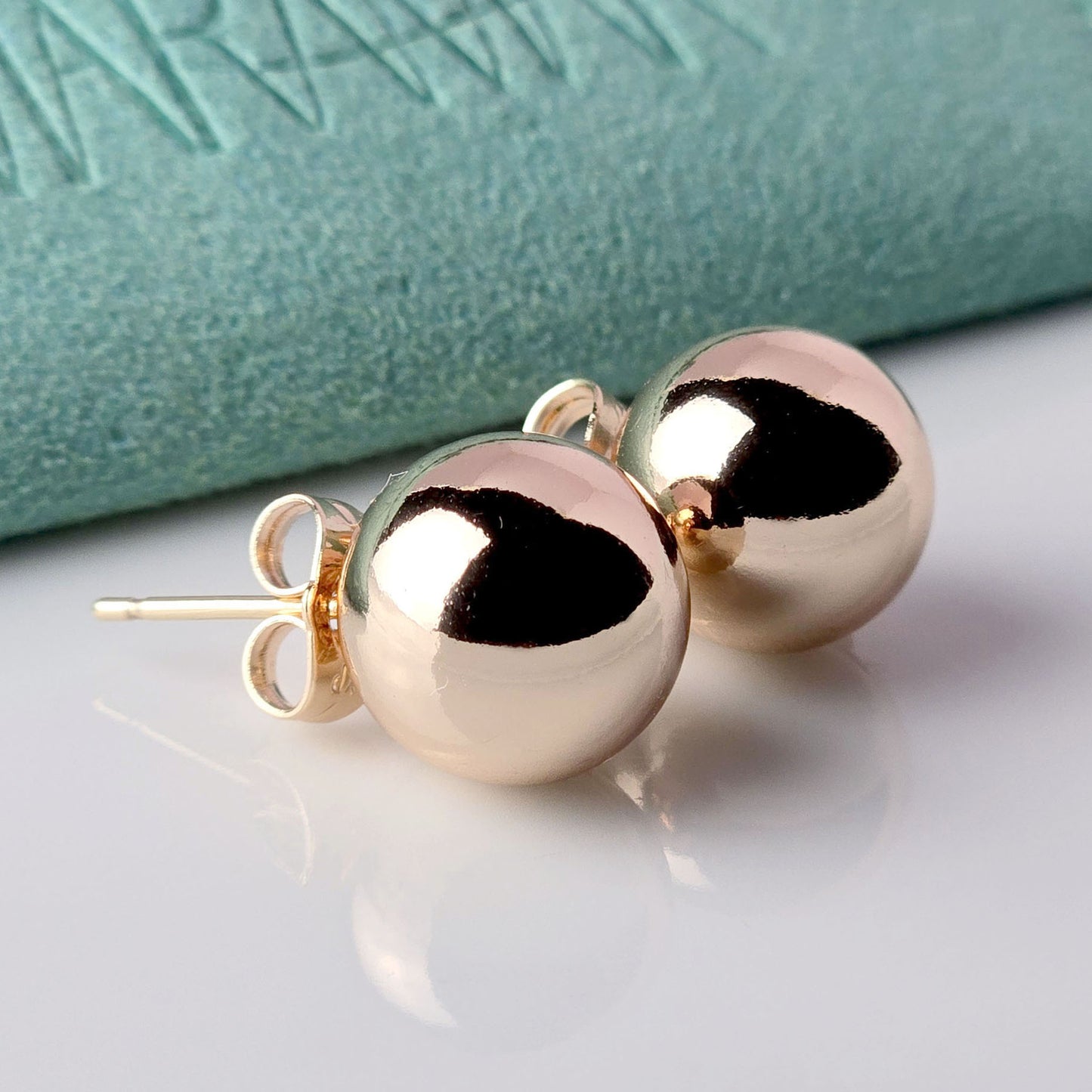 Made with the highest quality hypoallergenic, tarnish-proof stainless steel, our Medium Rose Gold Classic Ball Stud Earrings are both sustainable and low maintenance. You can wear these lightweight earrings every day without worrying about any allergic reactions or tarnishing. Upgrade your jewelry collection with these timeless and durable studs.