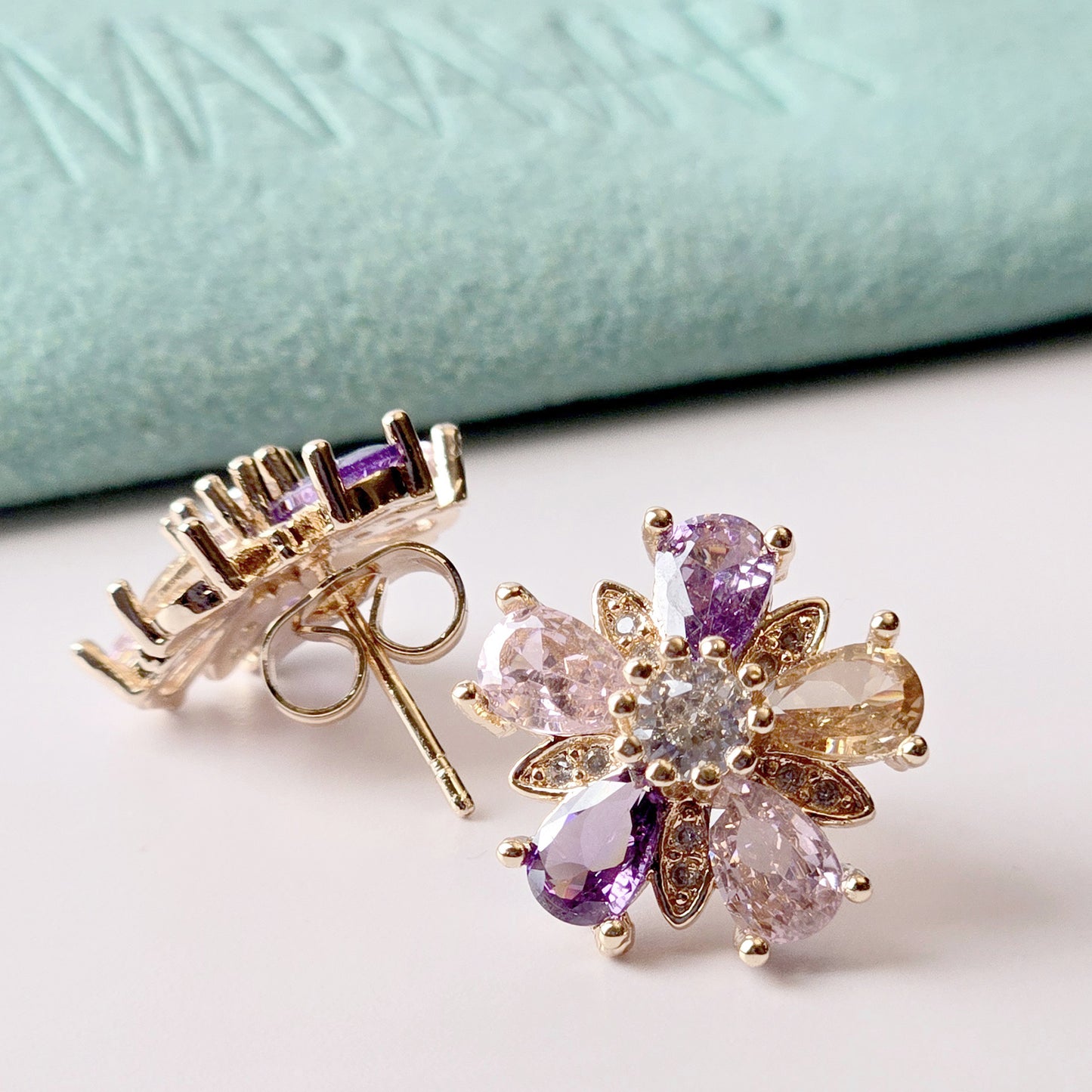 These medium-sized rose gold pink purple flower stud earrings are the perfect accessory for any outfit. Made with hypoallergenic and tarnish-proof stainless steel, they offer a sustainable and low maintenance option. Lightweight and stylish, they're a must-have for any jewelry collection.
