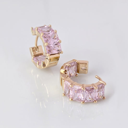Add a touch of elegance to any outfit with our Medium Rose Gold Pink Sparkle Huggie Earrings. Made of the highest quality hypoallergenic stainless steel, these earrings are tarnish-proof and sustainable, making them a low maintenance and lightweight option for everyday wear. Elevate your style with confidence.