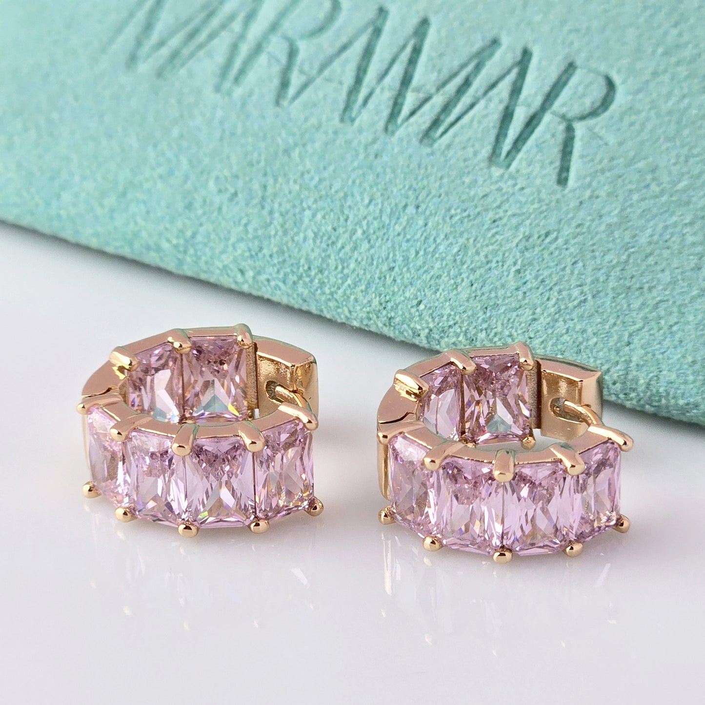 Add a touch of elegance to any outfit with our Medium Rose Gold Pink Sparkle Huggie Earrings. Made of the highest quality hypoallergenic stainless steel, these earrings are tarnish-proof and sustainable, making them a low maintenance and lightweight option for everyday wear. Elevate your style with confidence.