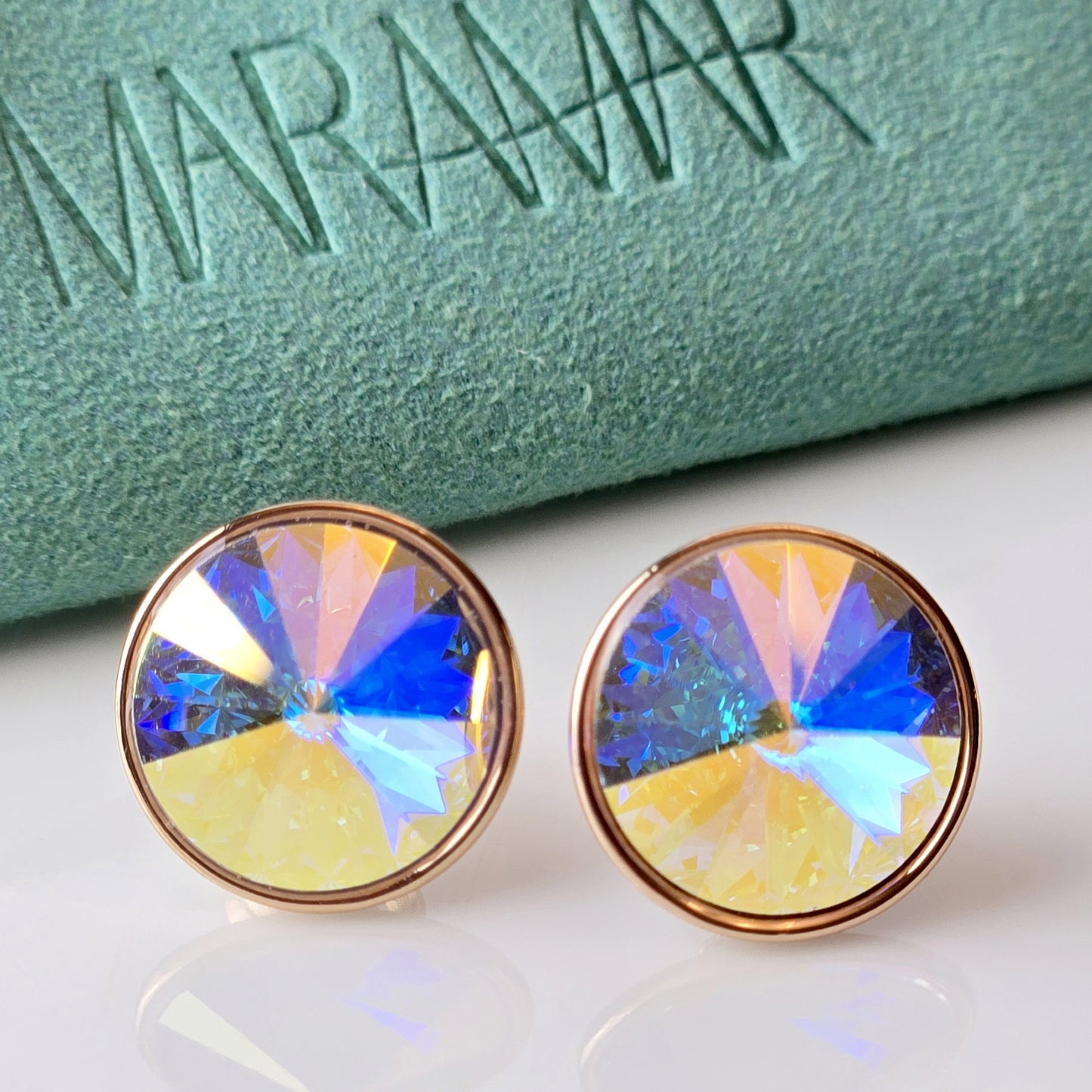 Expertly crafted using hypoallergenic, sustainable stainless steel, these Rose Gold Yellow Sparkle Stud Earrings offer superior quality. With water and sweat-resistant properties, these lightweight earrings are low maintenance and tarnish-proof. Perfect for all-day wear without irritation.