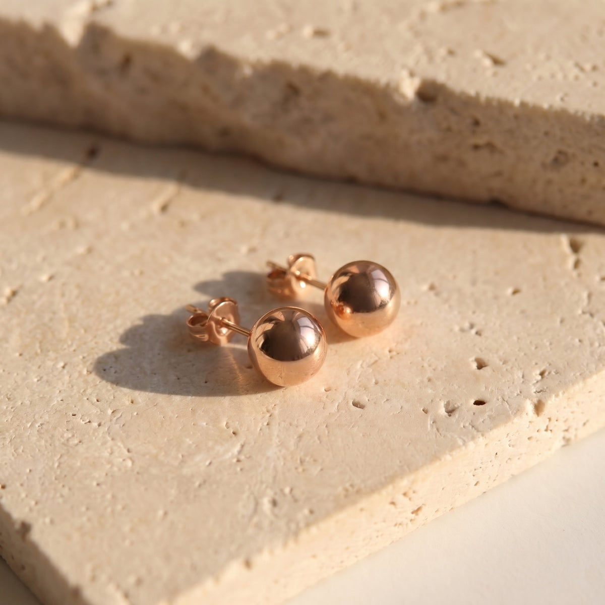 Made with the highest quality hypoallergenic, tarnish-proof stainless steel, our Small Rose Gold Classic Ball Stud Earrings are both sustainable and low maintenance. You can wear these lightweight earrings every day without worrying about any allergic reactions or tarnishing. Upgrade your jewelry collection with these timeless and durable studs.