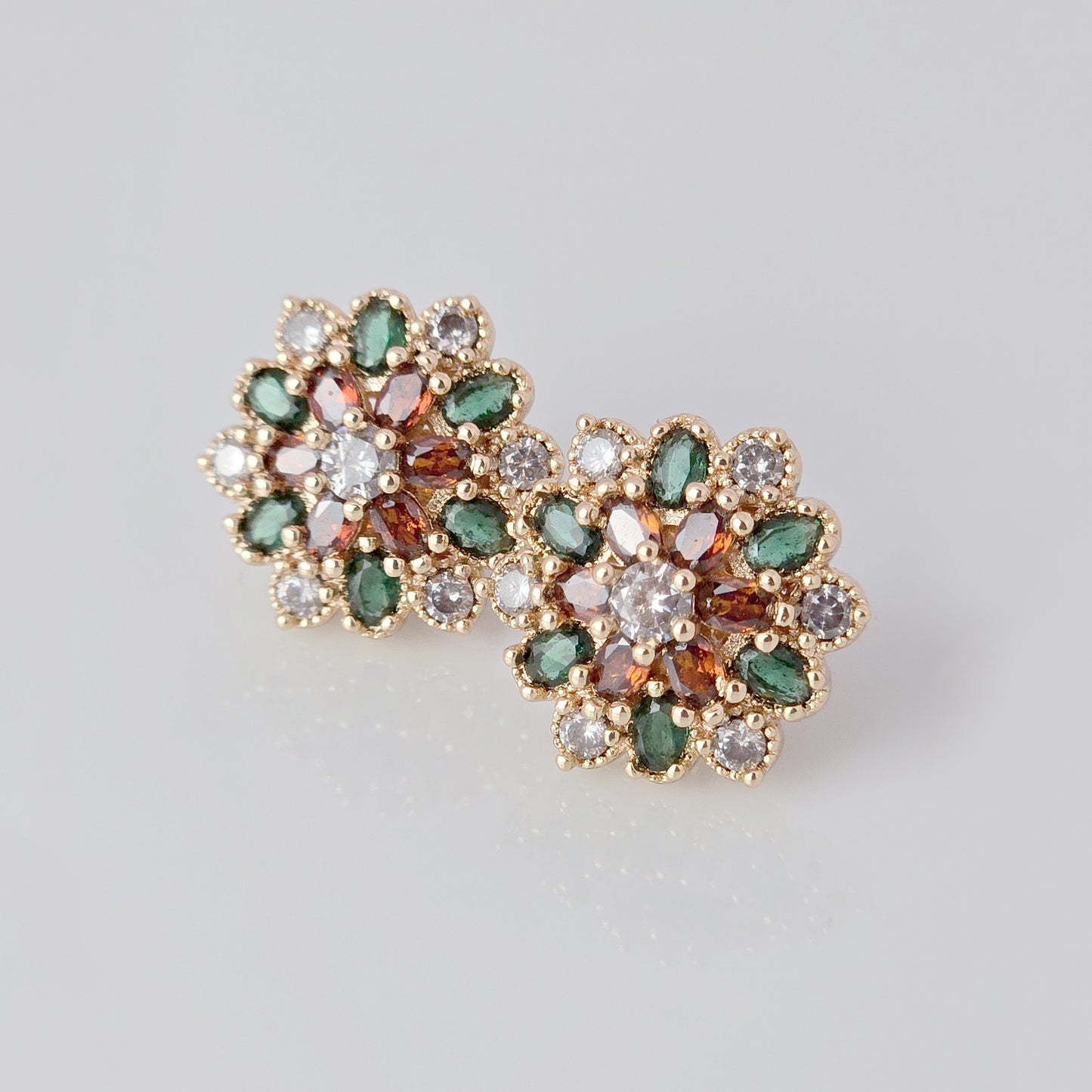 Each earring in this set of Small Rose Gold Green Red Flower Stud Earrings is made with hypoallergenic, high-quality stainless steel that is tarnish-proof and sustainable. Enjoy the benefit of low maintenance and lightweight earrings that will add a touch of color and elegance to any outfit.
