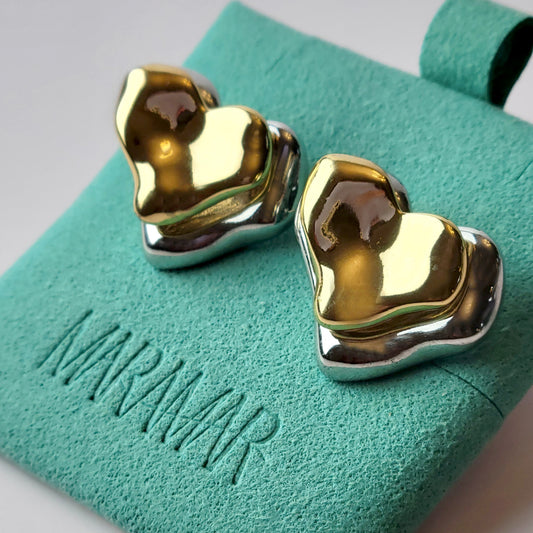 These Two-Tone Double Heart Stud Earrings are expertly crafted with hypoallergenic and sustainable stainless steel for a lightweight and low maintenance wear. With a tarnish-proof design, these earrings will retain their high-quality appearance for years to come. A perfect addition to any jewelry collection.