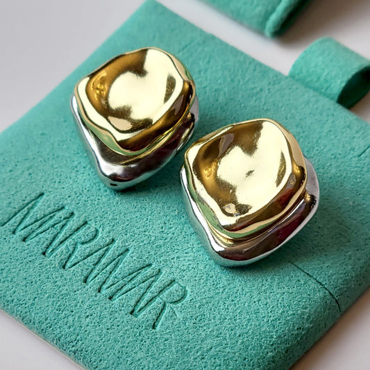 Crafted from premium stainless steel, these Two-Tone Double Square Stud Earrings offer the perfect blend of quality and style. Hypoallergenic and tarnish-proof, they require low maintenance and are lightweight for all-day comfort. Elevate any look with these sustainable earrings.