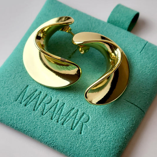 Crafted from the finest hypoallergenic stainless steel, our Weavy Gold Stud Earrings are perfect for those with sensitive ears. These earrings are also tarnish-proof, sustainable, and require minimal upkeep. Enjoy a lightweight and stylish option for any occasion.