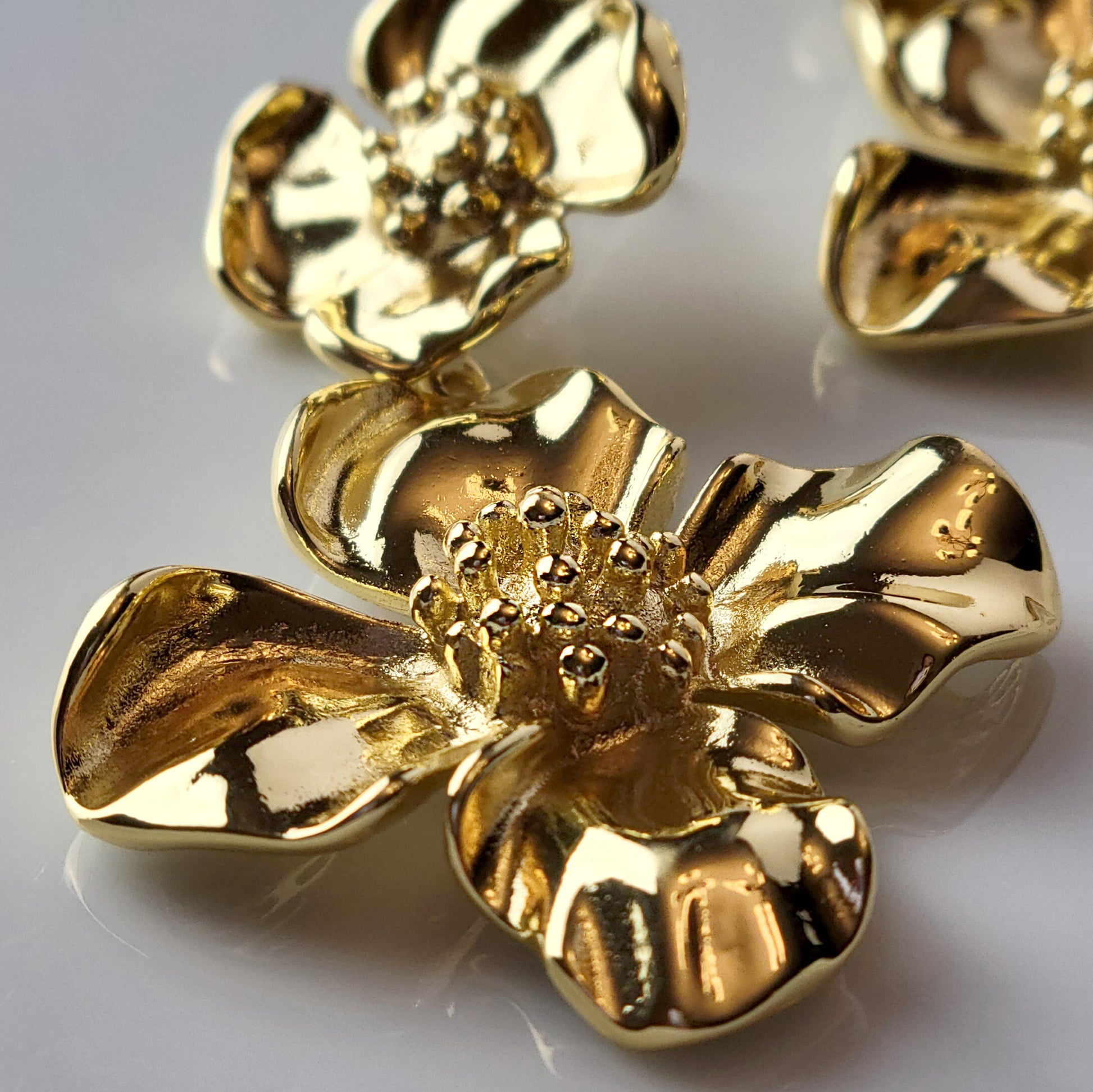 Expertly crafted with hypoallergenic stainless steel, our Double Flower Dangle Earrings are both sustainable and low maintenance. With superior quality and lightweight design, these earrings are perfect for everyday wear. Say goodbye to tarnishing and hello to timeless style.