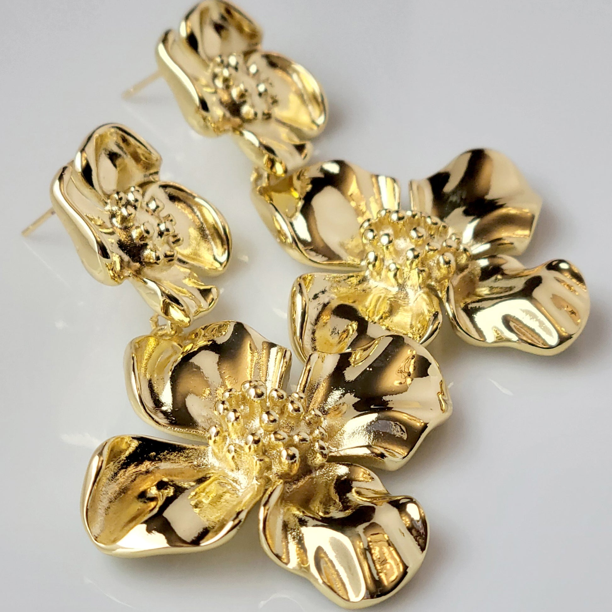 Expertly crafted with hypoallergenic stainless steel, our Double Flower Dangle Earrings are both sustainable and low maintenance. With superior quality and lightweight design, these earrings are perfect for everyday wear. Say goodbye to tarnishing and hello to timeless style.