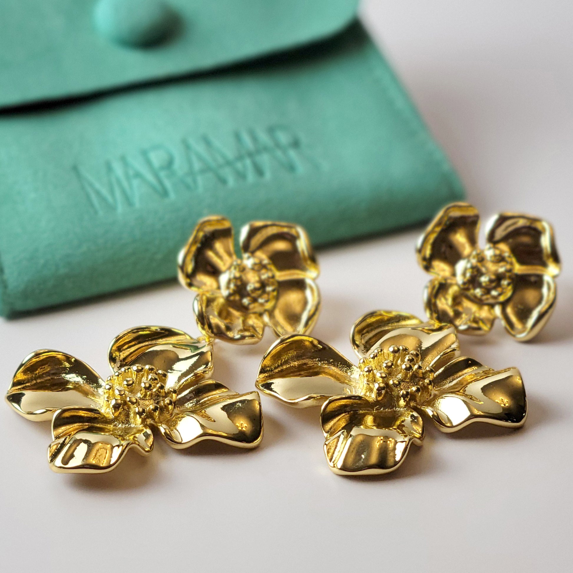 Expertly crafted with hypoallergenic stainless steel, our Double Flower Dangle Earrings are both sustainable and low maintenance. With superior quality and lightweight design, these earrings are perfect for everyday wear. Say goodbye to tarnishing and hello to timeless style.