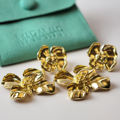 Expertly crafted with hypoallergenic stainless steel, our Double Flower Dangle Earrings are both sustainable and low maintenance. With superior quality and lightweight design, these earrings are perfect for everyday wear. Say goodbye to tarnishing and hello to timeless style.