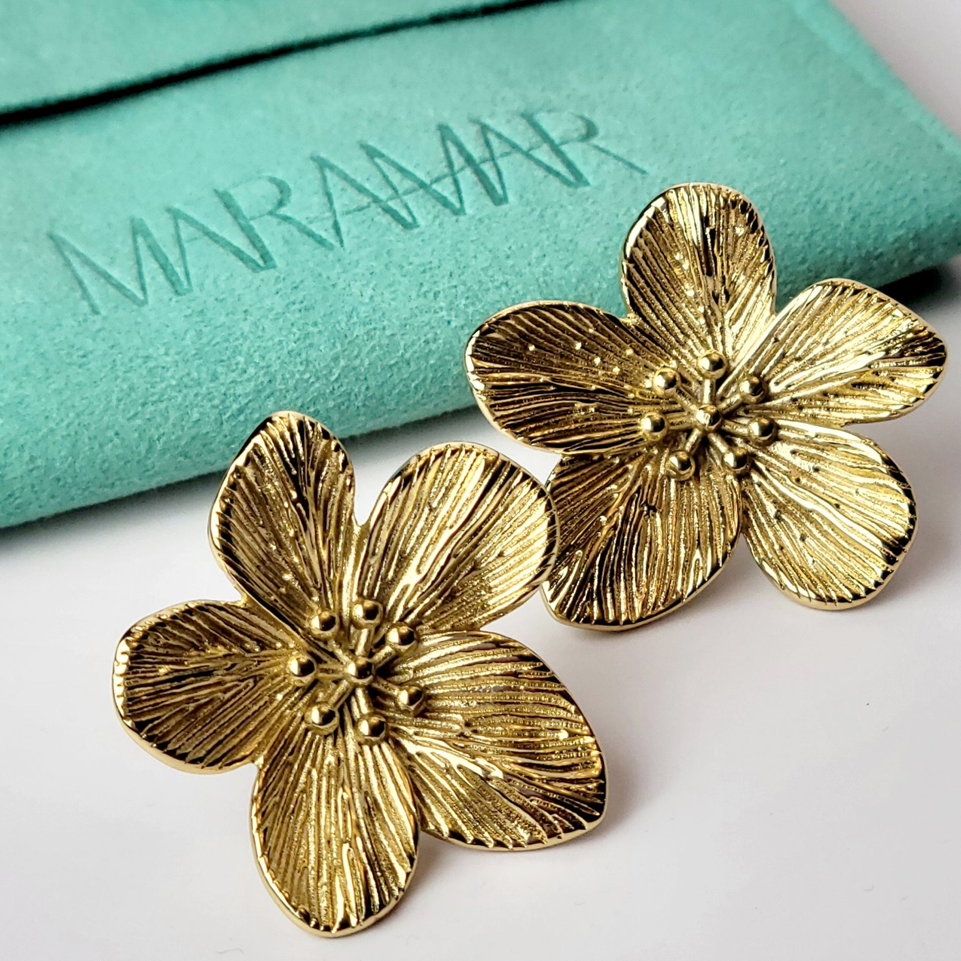 Expertly crafted from hypoallergenic, tarnish-proof stainless steel, these Gold Flower Stud Earrings offer both quality and sustainability. With a low maintenance design and lightweight feel, these earrings are the perfect addition to any jewelry collection.