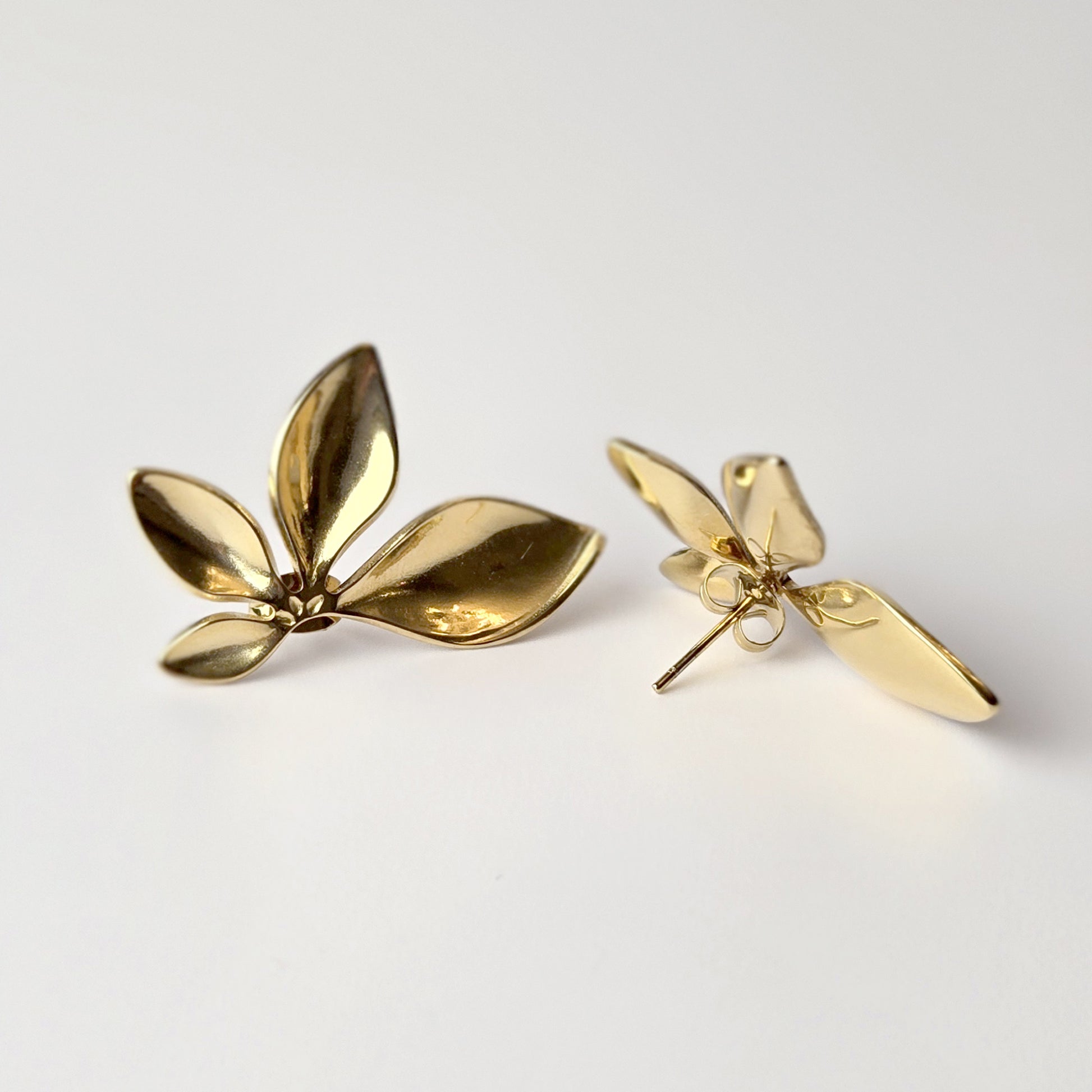 Expertly crafted with the highest quality stainless steel, these half flower stud earrings offer hypoallergenic and water-resistant wear. Sweat-proof and tarnish-proof, they require low maintenance and are a sustainable choice. Lightweight and stylish, these earrings are a must-have for any jewelry collection.