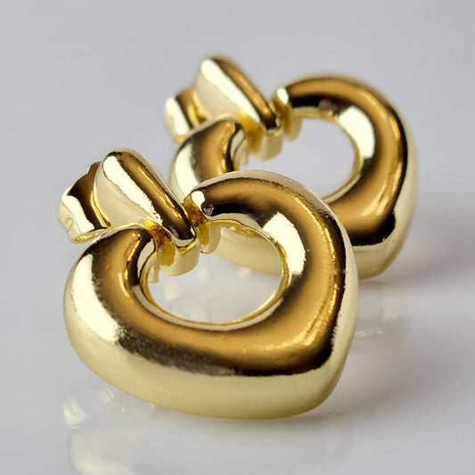 Introducing our Gold Heart Dangle Earrings, crafted from hypoallergenic, tarnish-proof stainless steel. These earrings are not only sustainable, but also low maintenance and lightweight for comfortable wear. Upgrade your style with the highest quality and durability.