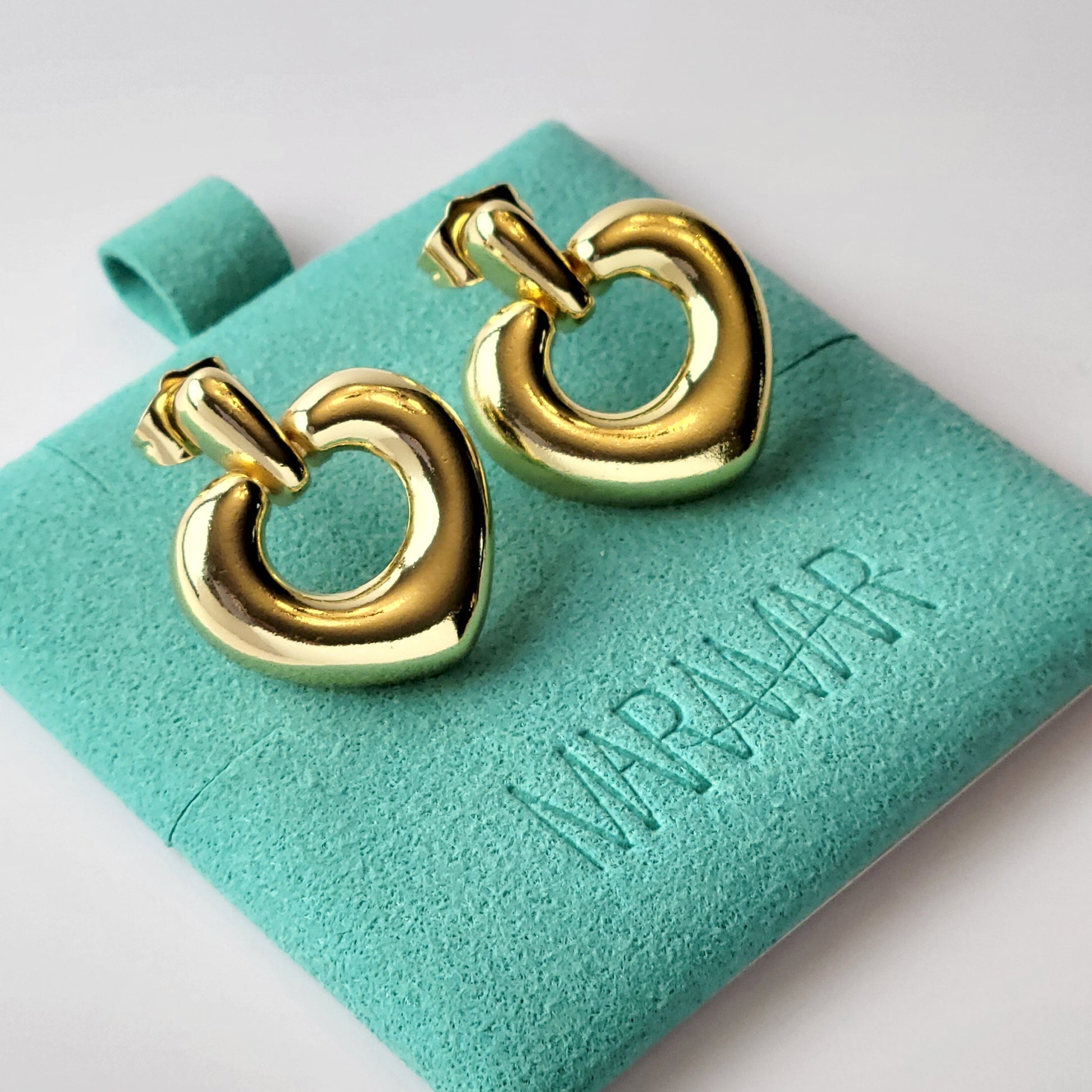 Introducing our Gold Heart Dangle Earrings, crafted from hypoallergenic, tarnish-proof stainless steel. These earrings are not only sustainable, but also low maintenance and lightweight for comfortable wear. Upgrade your style with the highest quality and durability.