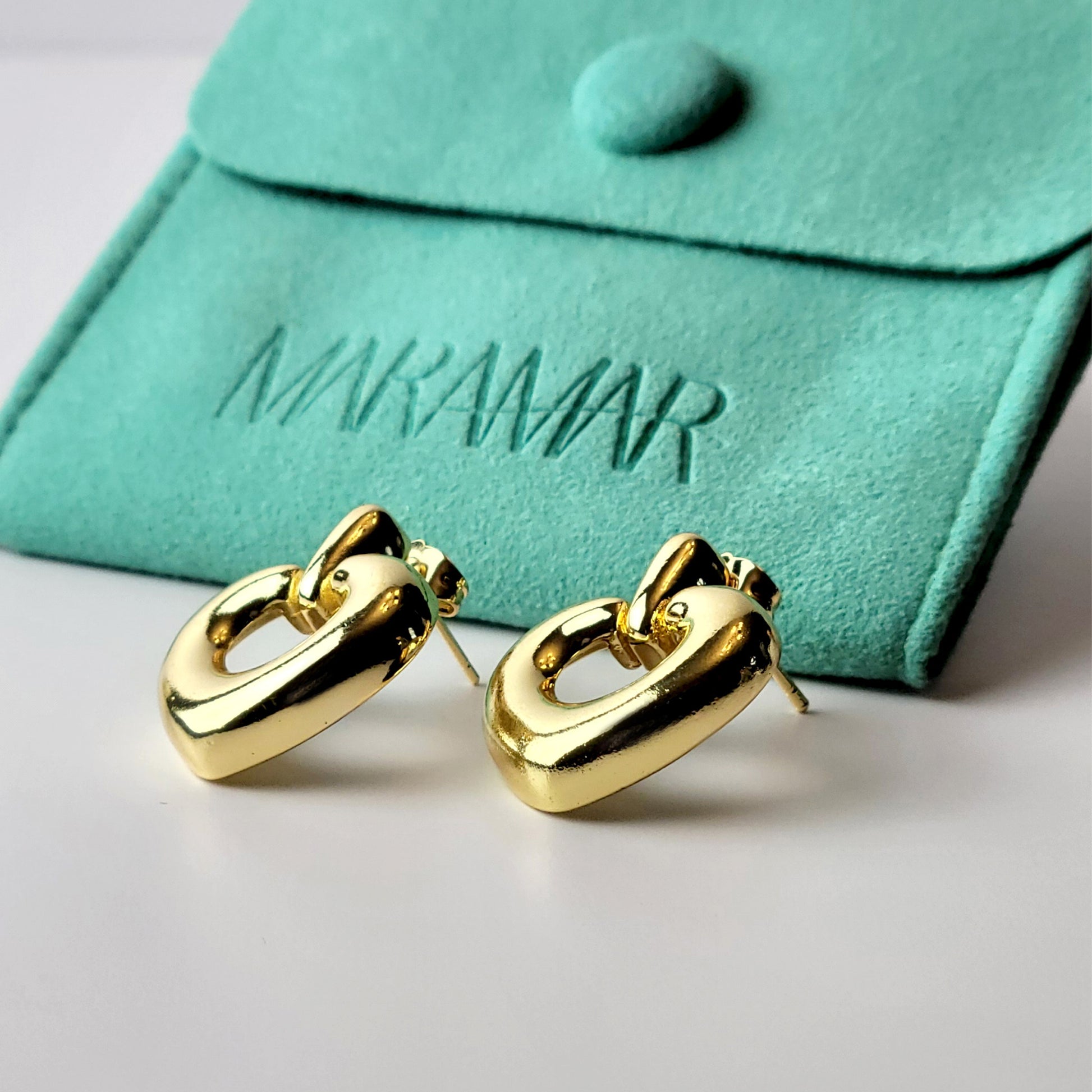 Introducing our Gold Heart Dangle Earrings, crafted from hypoallergenic, tarnish-proof stainless steel. These earrings are not only sustainable, but also low maintenance and lightweight for comfortable wear. Upgrade your style with the highest quality and durability.