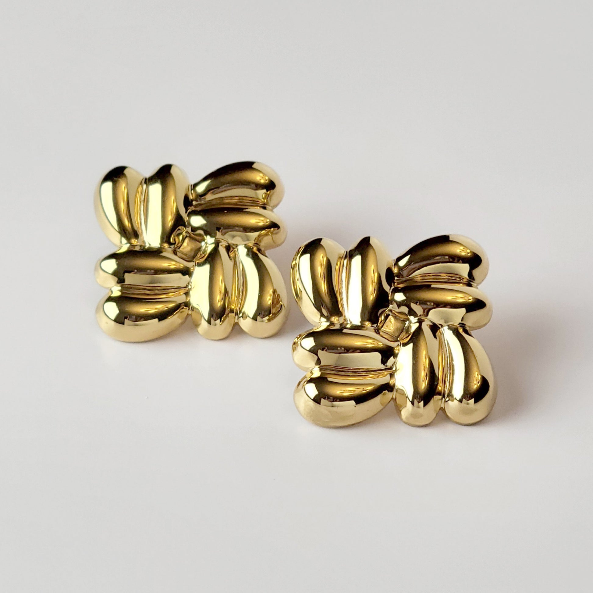 Expertly crafted with the highest quality hypoallergenic stainless steel, these Gold Square Stud Earrings are both sustainable and low maintenance. Enjoy the lightweight comfort while never having to worry about tarnishing. The perfect addition to any jewelry collection.