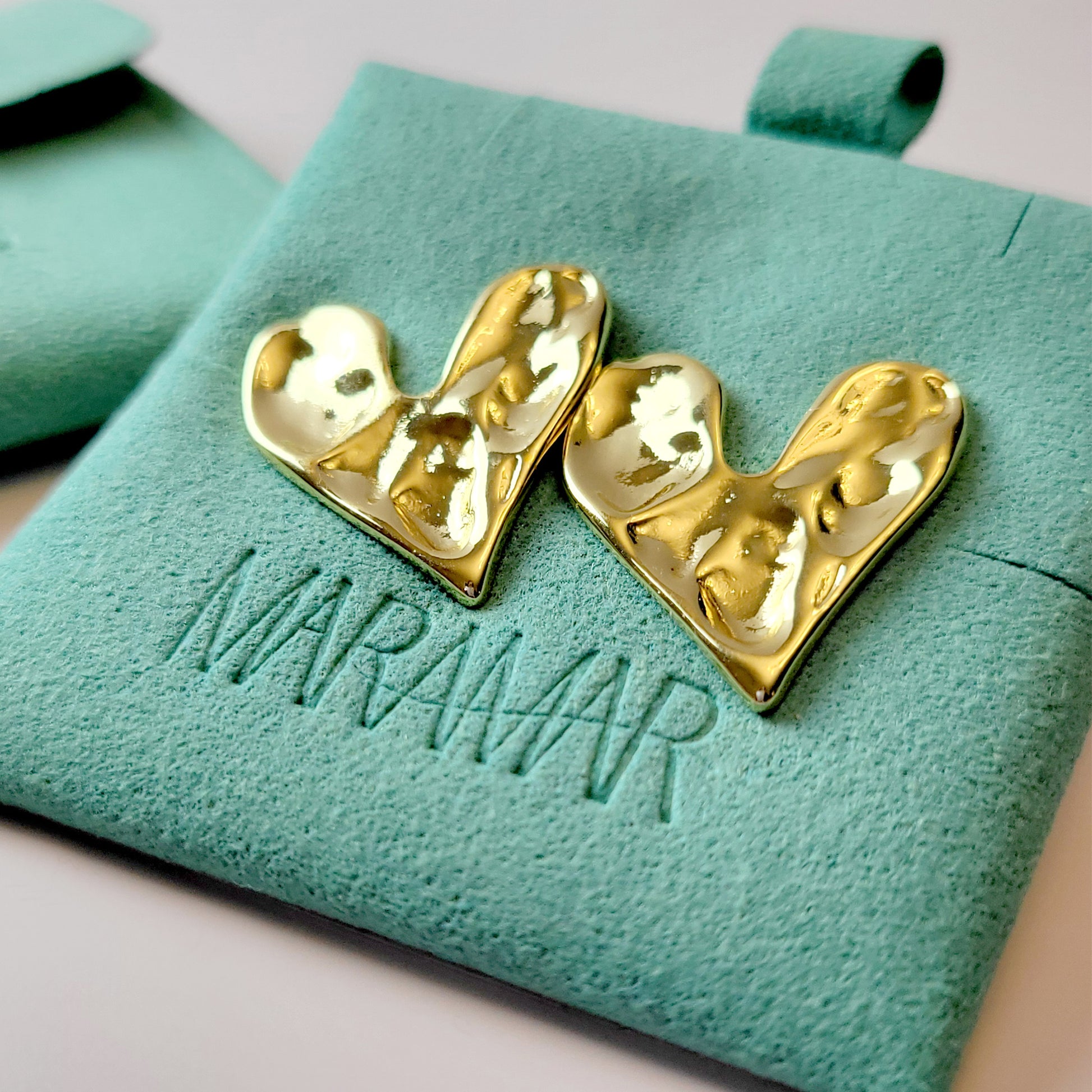 These Gold Stone Heart Stud Earrings are crafted with the highest quality hypoallergenic stainless steel, making them perfect for sensitive skin. Not only are they tarnish-proof for easy maintenance, but their sustainable and lightweight design is highly practical.
