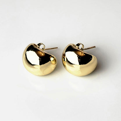 Expertly crafted with hypoallergenic stainless steel, these Golden Bean Stud Earrings are not only stylish but also sustainable. Tarnish-proof and low maintenance, they offer the perfect balance of quality and ease for everyday wear. Elevate your jewelry collection with these lightweight must-haves.