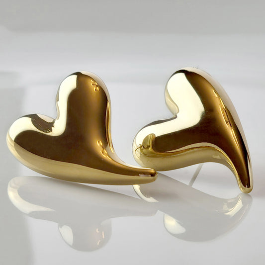 Made from hypoallergenic, tarnish-proof stainless steel, these Golden Heart Stud Earrings are not only sustainable and low maintenance, but also lightweight for comfortable wear. Perfect for those with sensitive ears, these will add a touch of elegance to any outfit.