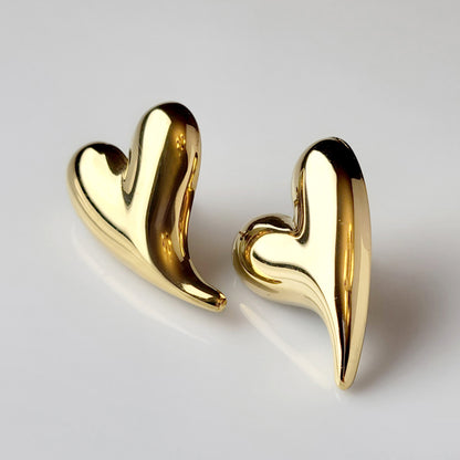 Made from hypoallergenic, tarnish-proof stainless steel, these Golden Heart Stud Earrings are not only sustainable and low maintenance, but also lightweight for comfortable wear. Perfect for those with sensitive ears, these will add a touch of elegance to any outfit.
