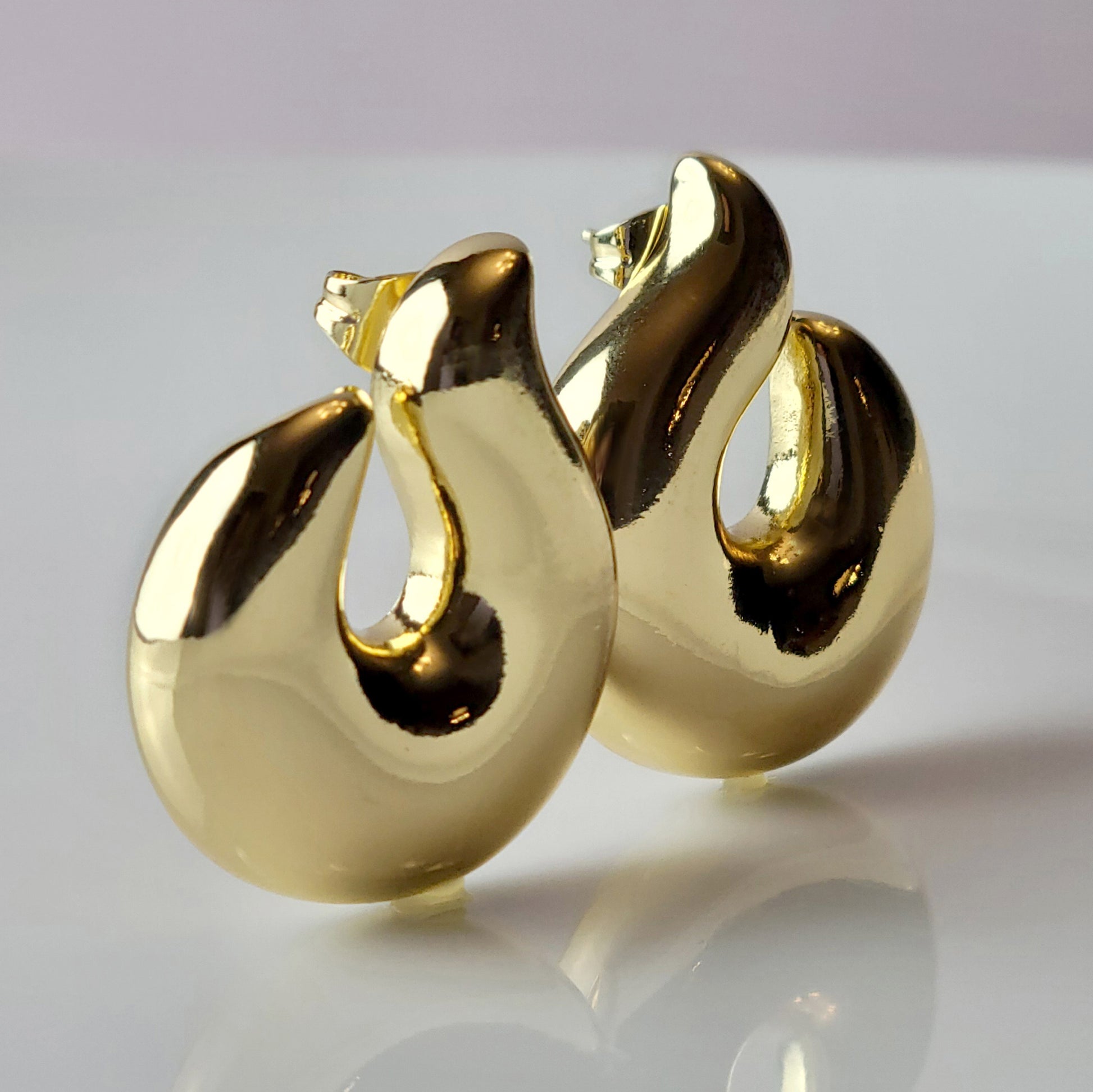 Elevate your style with our Golden Hook Stud Earrings, expertly crafted with hypoallergenic stainless steel for maximum comfort and sustainability. The tarnish-proof finish ensures low maintenance while the lightweight design offers all-day wearability. Make a statement with these high-quality pieces.