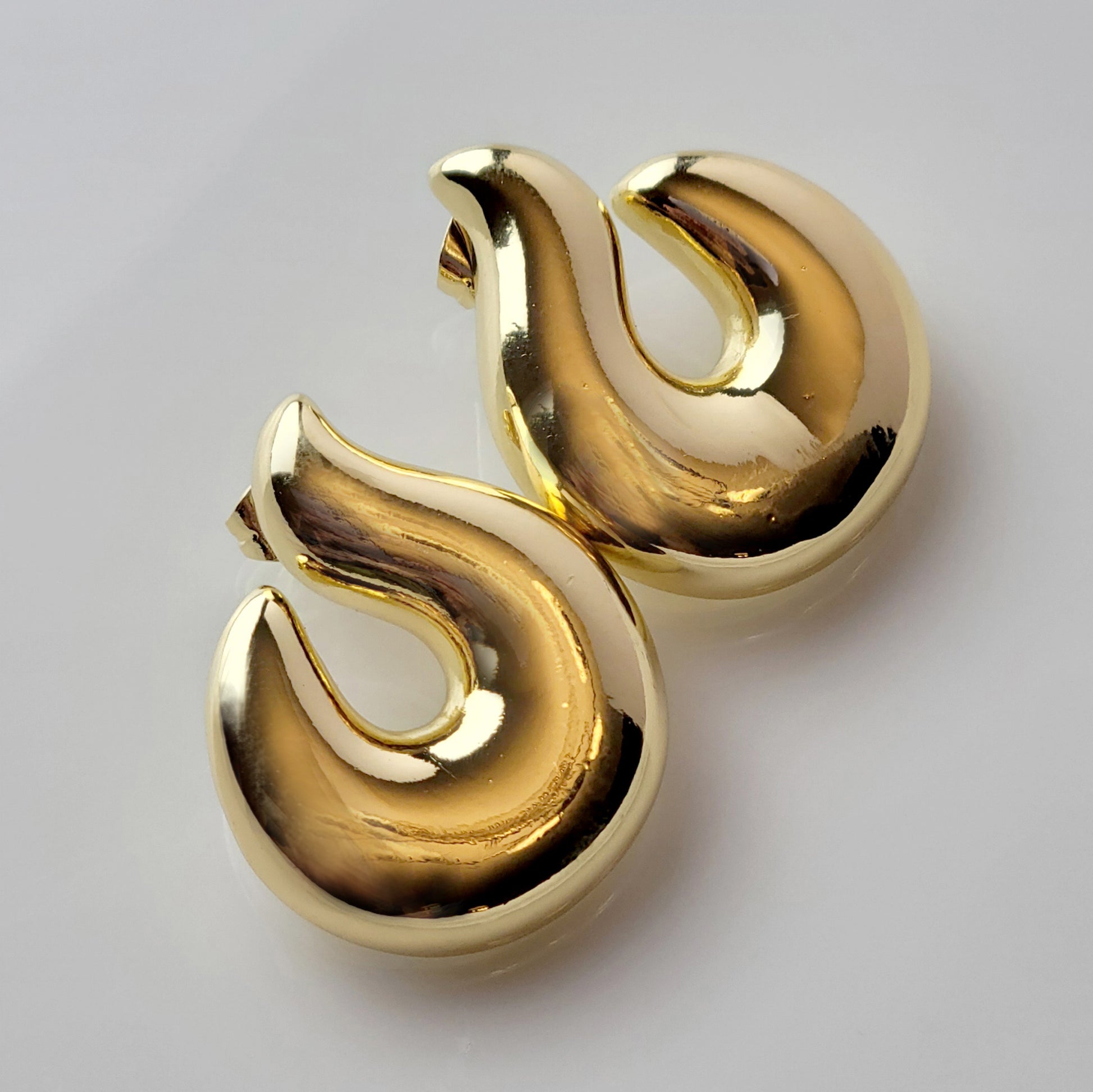 Elevate your style with our Golden Hook Stud Earrings, expertly crafted with hypoallergenic stainless steel for maximum comfort and sustainability. The tarnish-proof finish ensures low maintenance while the lightweight design offers all-day wearability. Make a statement with these high-quality pieces.