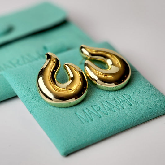 Elevate your style with our Golden Hook Stud Earrings, expertly crafted with hypoallergenic stainless steel for maximum comfort and sustainability. The tarnish-proof finish ensures low maintenance while the lightweight design offers all-day wearability. Make a statement with these high-quality pieces.