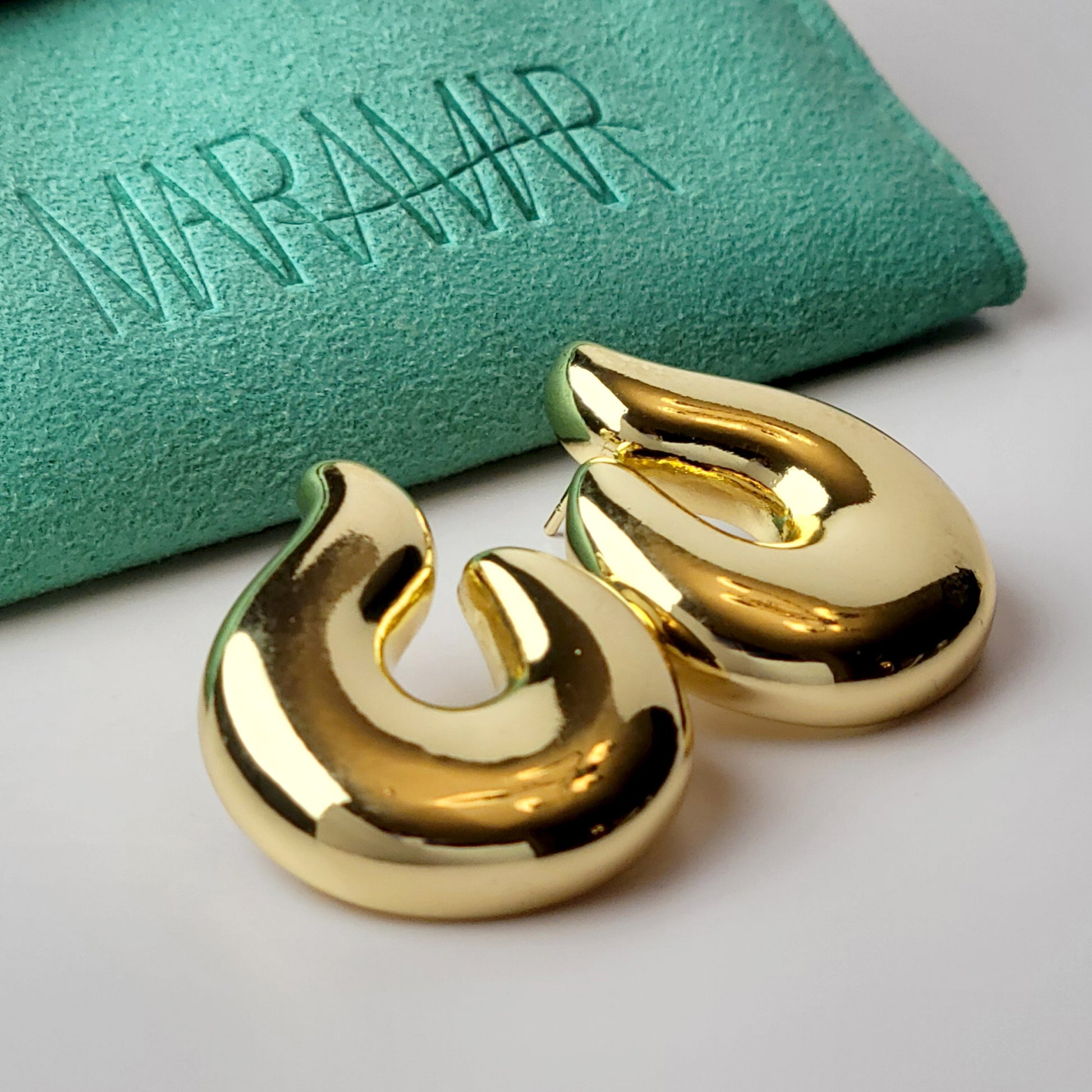 Elevate your style with our Golden Hook Stud Earrings, expertly crafted with hypoallergenic stainless steel for maximum comfort and sustainability. The tarnish-proof finish ensures low maintenance while the lightweight design offers all-day wearability. Make a statement with these high-quality pieces.