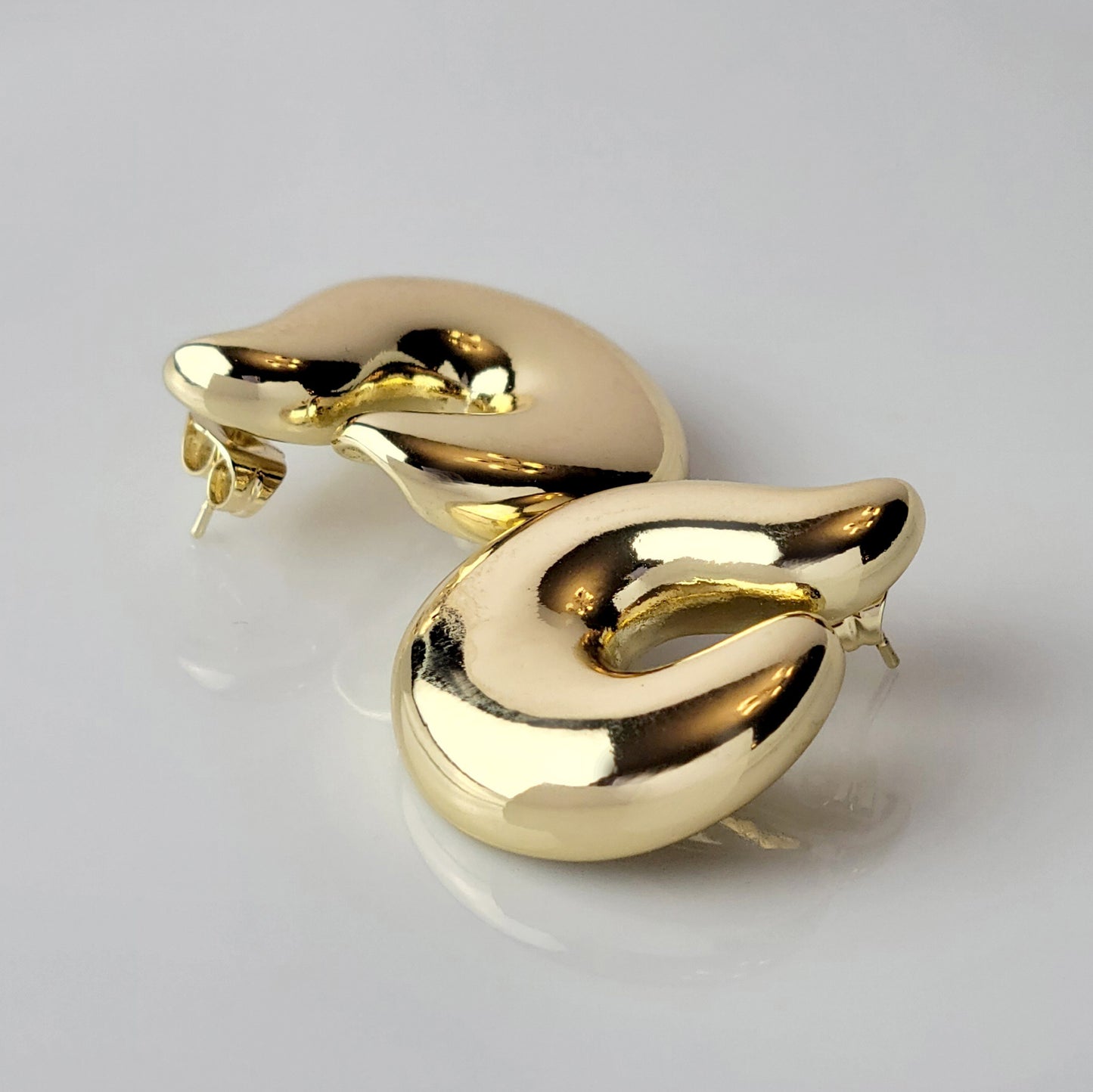 Elevate your style with our Golden Hook Stud Earrings, expertly crafted with hypoallergenic stainless steel for maximum comfort and sustainability. The tarnish-proof finish ensures low maintenance while the lightweight design offers all-day wearability. Make a statement with these high-quality pieces.