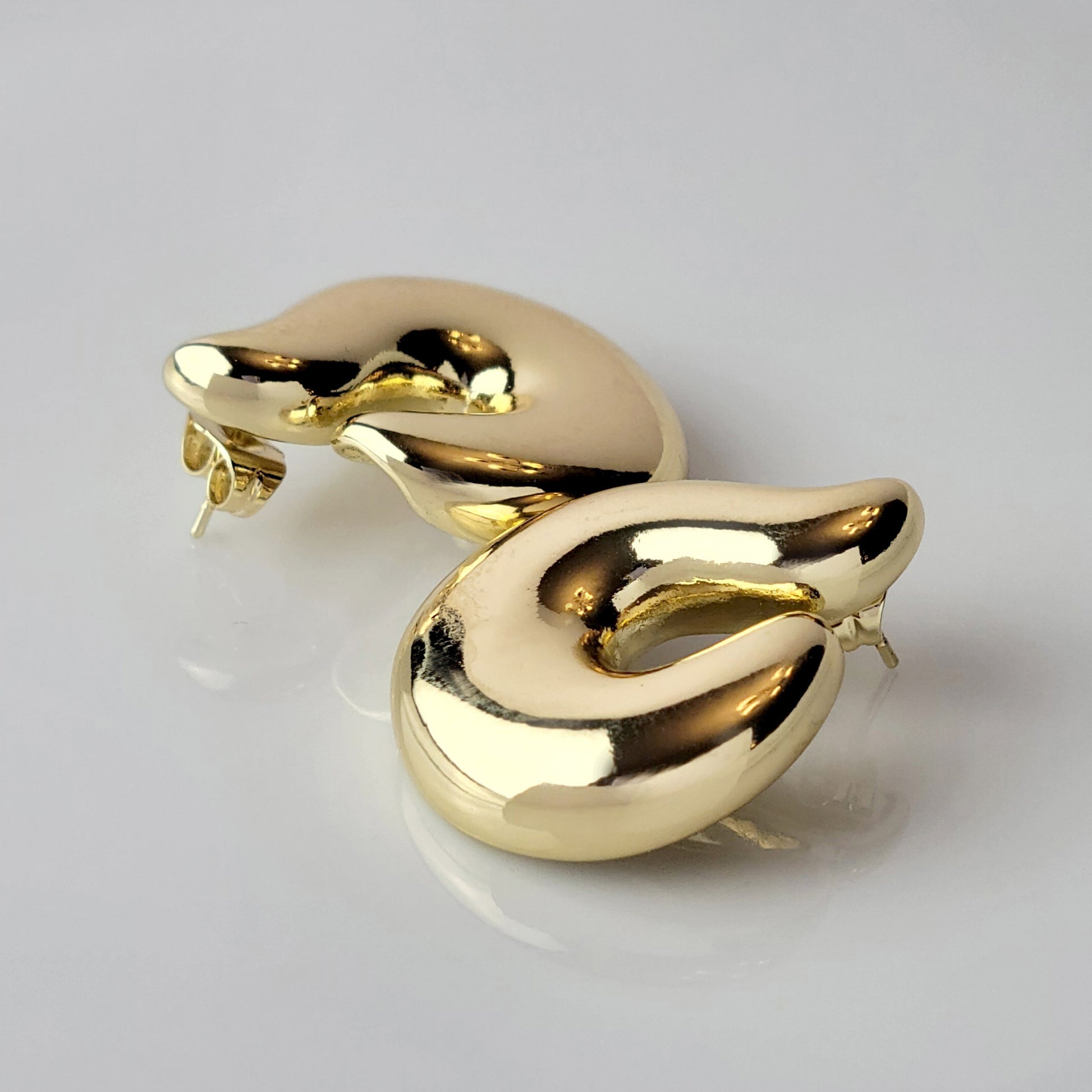Elevate your style with our Golden Hook Stud Earrings, expertly crafted with hypoallergenic stainless steel for maximum comfort and sustainability. The tarnish-proof finish ensures low maintenance while the lightweight design offers all-day wearability. Make a statement with these high-quality pieces.