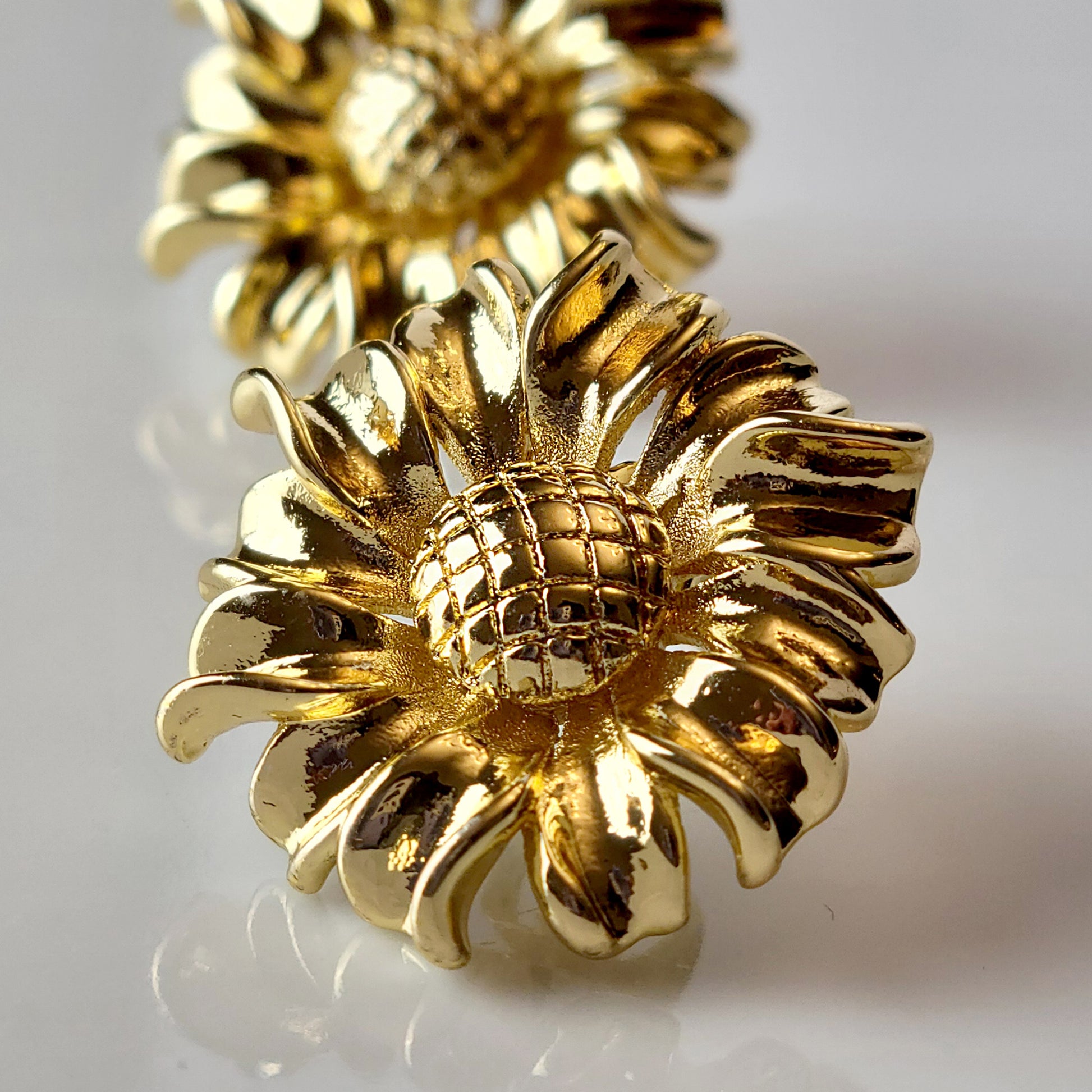 Expertly crafted from hypoallergenic and tarnish-proof stainless steel, these Golden Sunflower Stud Earrings are both sustainable and low-maintenance. With their lightweight design, they offer both style and comfort for everyday wear. Elevate any outfit with these high-quality and versatile earrings.
