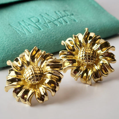 Expertly crafted from hypoallergenic and tarnish-proof stainless steel, these Golden Sunflower Stud Earrings are both sustainable and low-maintenance. With their lightweight design, they offer both style and comfort for everyday wear. Elevate any outfit with these high-quality and versatile earrings.