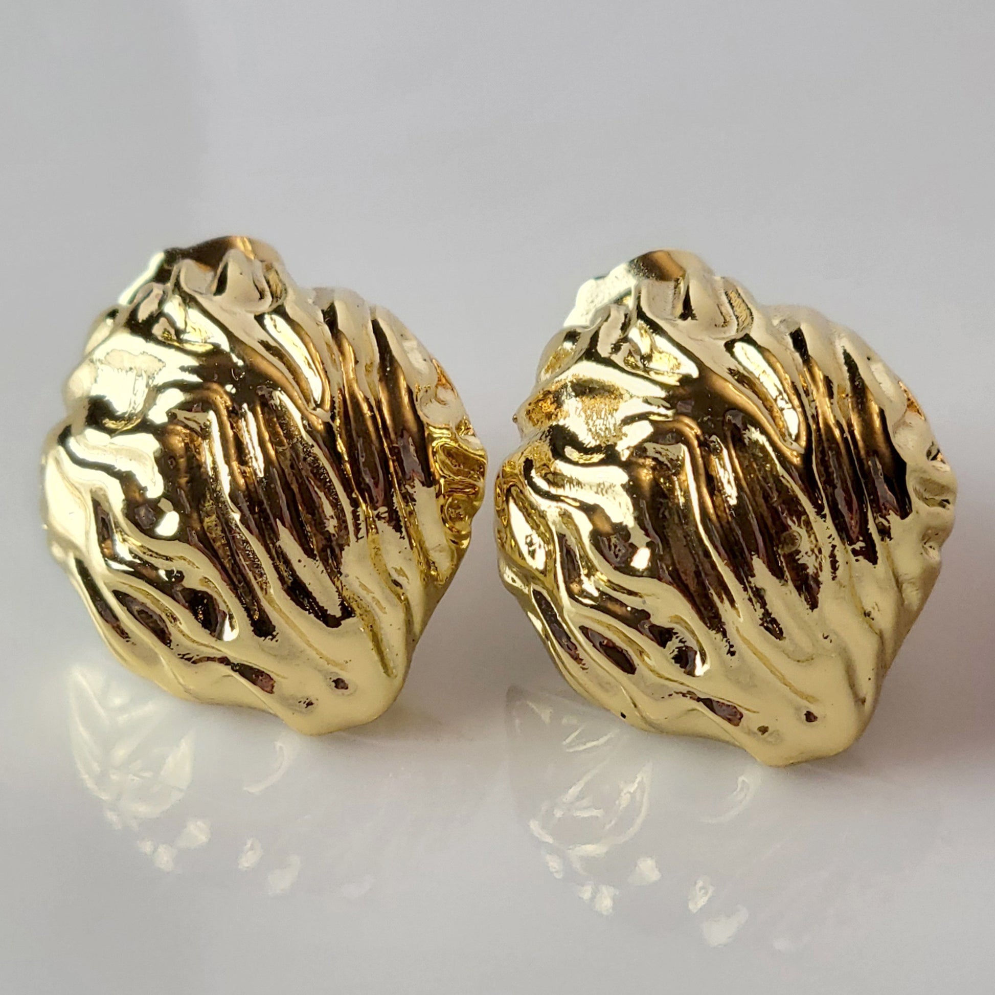 Crafted from premium, hypoallergenic stainless steel, our Golden Walnut Stud Earrings are built to last. The tarnish-proof material ensures they will maintain their shine for years to come. Plus, they're lightweight and sustainable, making them the perfect low maintenance accessory for any outfit.