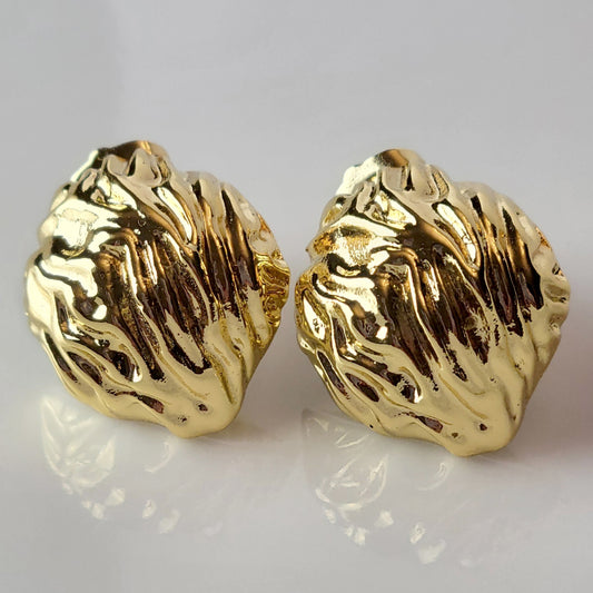 Crafted from premium, hypoallergenic stainless steel, our Golden Walnut Stud Earrings are built to last. The tarnish-proof material ensures they will maintain their shine for years to come. Plus, they're lightweight and sustainable, making them the perfect low maintenance accessory for any outfit.